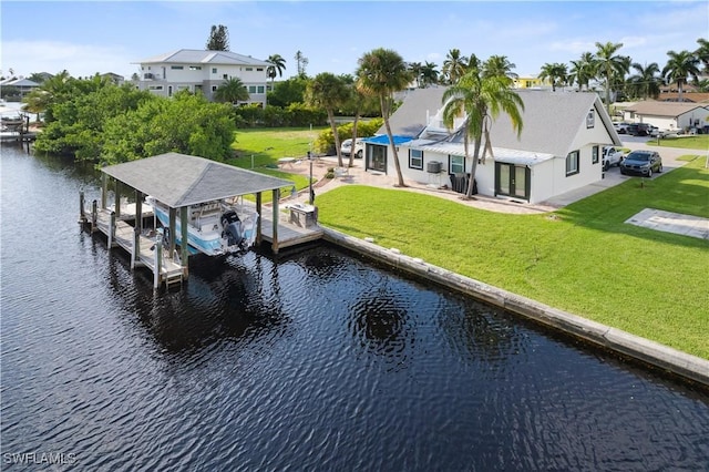 dock area with a water view and a yard