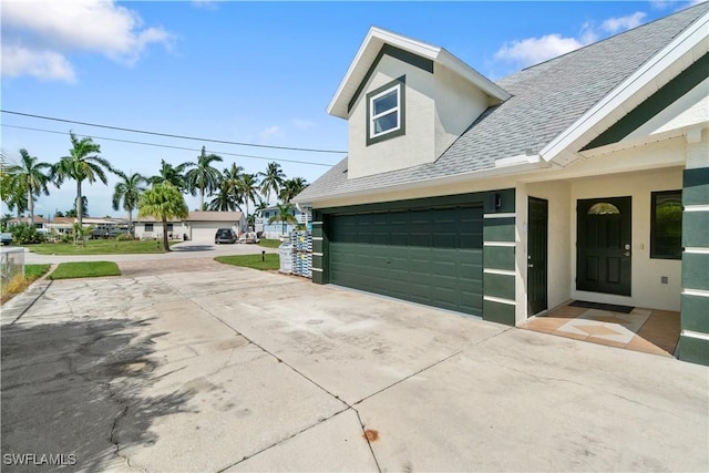 view of side of home with a garage