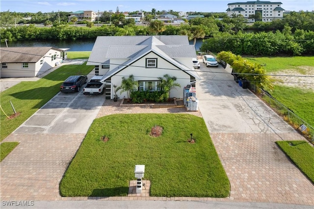 view of front of home featuring a water view and a front yard