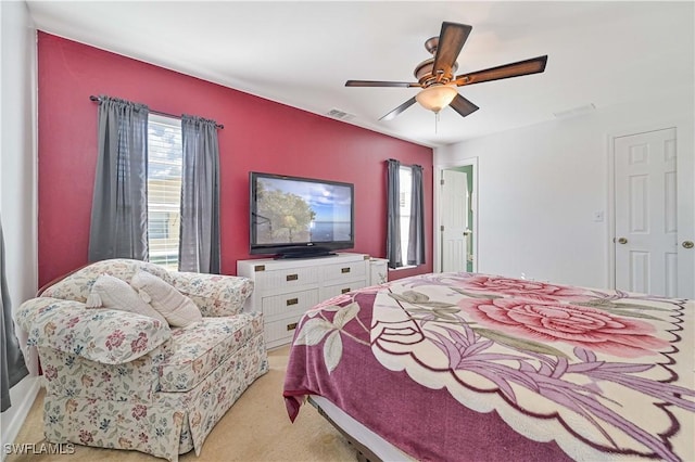 bedroom with light colored carpet and ceiling fan