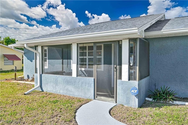 property entrance with a yard