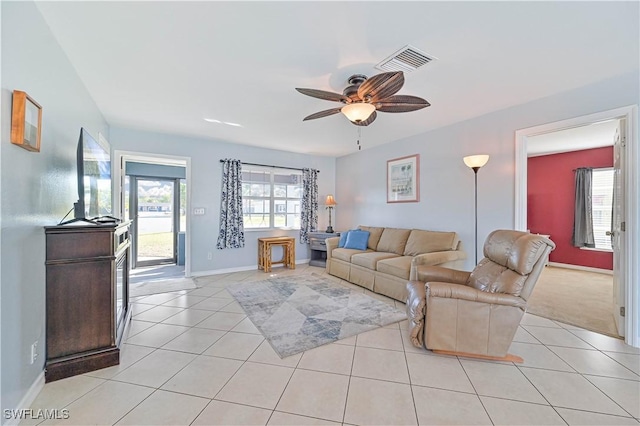 living room featuring ceiling fan and light tile patterned floors