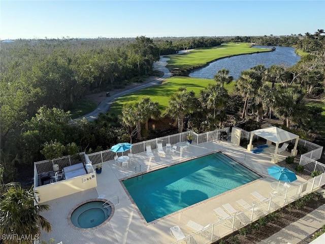 2619 Wulfert Rd Unit 5, Sanibel, FL 33957 - community pool with a water view, fence, a patio area, and golf course view