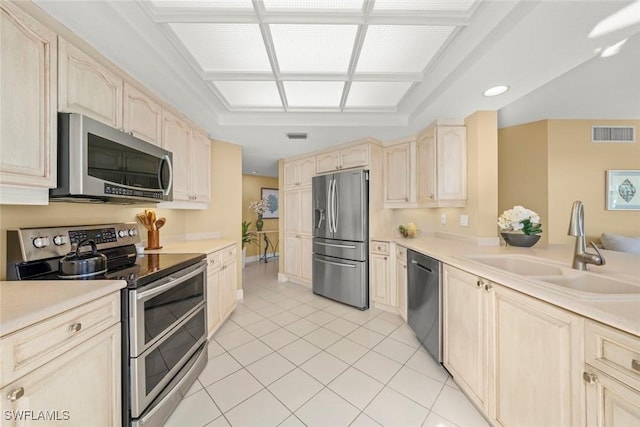 2619 Wulfert Rd Unit 5, Sanibel, FL 33957 - kitchen with appliances with stainless steel finishes, a sink, light tile patterned flooring, light countertops, and recessed lighting