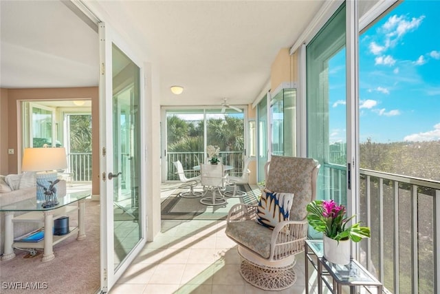 2619 Wulfert Rd Unit 5, Sanibel, FL 33957 - sunroom with tile patterned floors and plenty of natural light