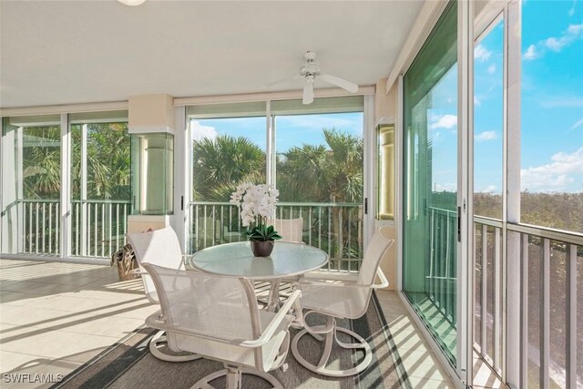 2619 Wulfert Rd Unit 5, Sanibel, FL 33957 - sunroom / solarium featuring ceiling fan, healthy amount of natural light, and tile patterned floors