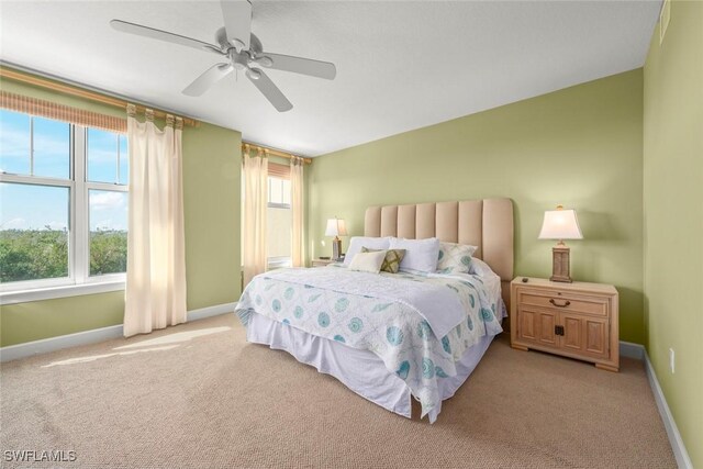 2619 Wulfert Rd Unit 5, Sanibel, FL 33957 - bedroom featuring light colored carpet, baseboards, and a ceiling fan