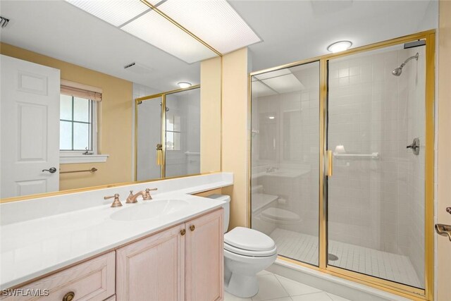2619 Wulfert Rd Unit 5, Sanibel, FL 33957 - full bath featuring a stall shower, toilet, tile patterned flooring, and vanity