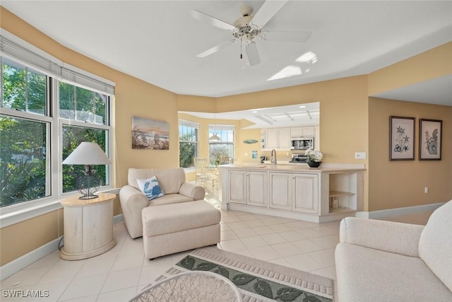 2619 Wulfert Rd Unit 5, Sanibel, FL 33957 - living area featuring healthy amount of natural light, baseboards, and light tile patterned floors