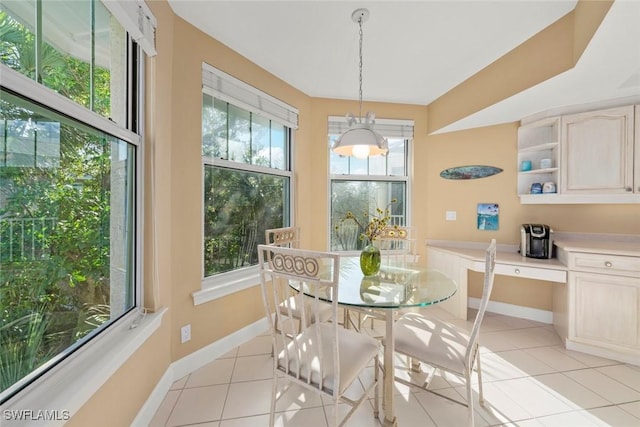 2619 Wulfert Rd Unit 5, Sanibel, FL 33957 - dining room with light tile patterned floors and baseboards