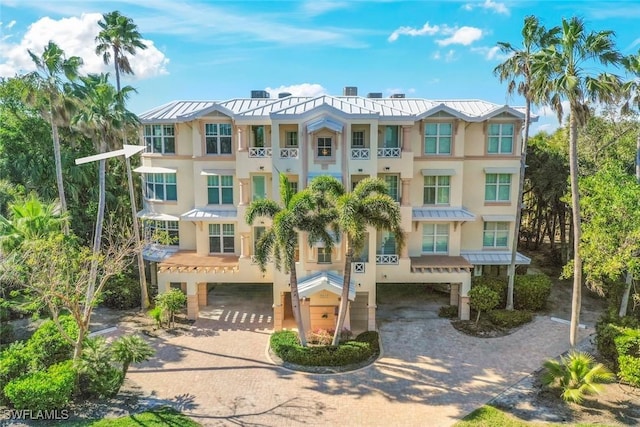 2619 Wulfert Rd Unit 5, Sanibel, FL 33957 - view of property featuring decorative driveway and a carport