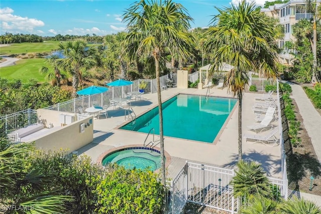 2619 Wulfert Rd Unit 5, Sanibel, FL 33957 - community pool with a community hot tub, fence, and golf course view