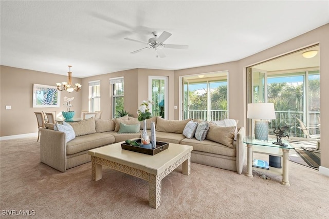 2619 Wulfert Rd Unit 5, Sanibel, FL 33957 - living area with a chandelier, light colored carpet, and plenty of natural light