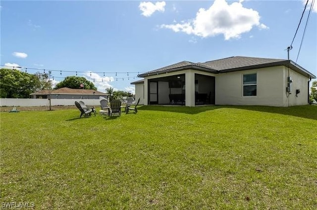 back of property featuring a lawn