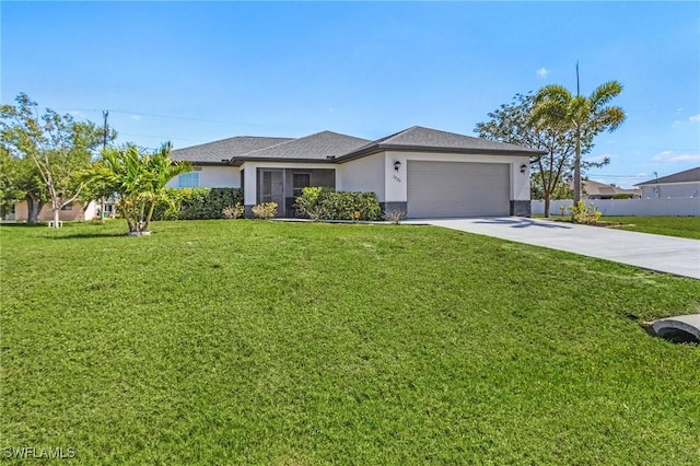 view of front of property featuring stucco siding, a front lawn, driveway, fence, and a garage