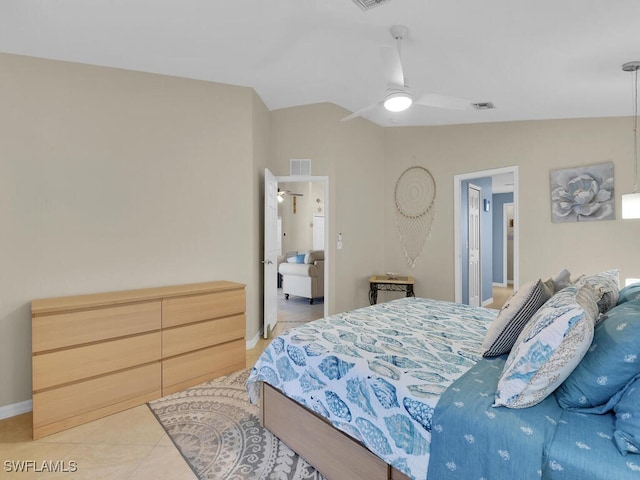 bedroom featuring ceiling fan, vaulted ceiling, and light tile patterned floors