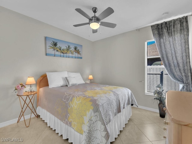 bedroom with ceiling fan and light tile patterned flooring