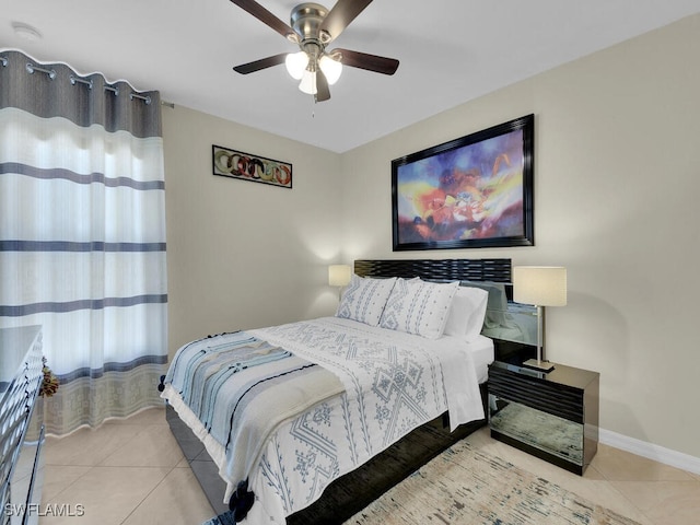 tiled bedroom with ceiling fan