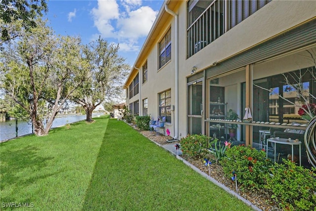 view of yard with a water view