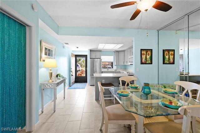 dining room featuring ceiling fan