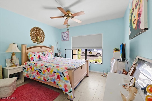 bedroom with ceiling fan and light tile patterned flooring