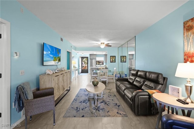 living room featuring ceiling fan