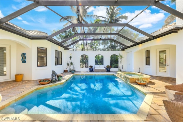 view of swimming pool with an outdoor hangout area, a patio, glass enclosure, and an in ground hot tub