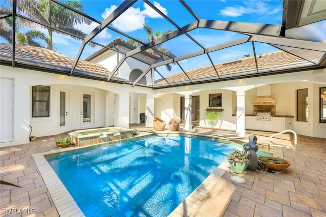 view of swimming pool featuring an outdoor kitchen, a patio area, glass enclosure, an in ground hot tub, and a grill