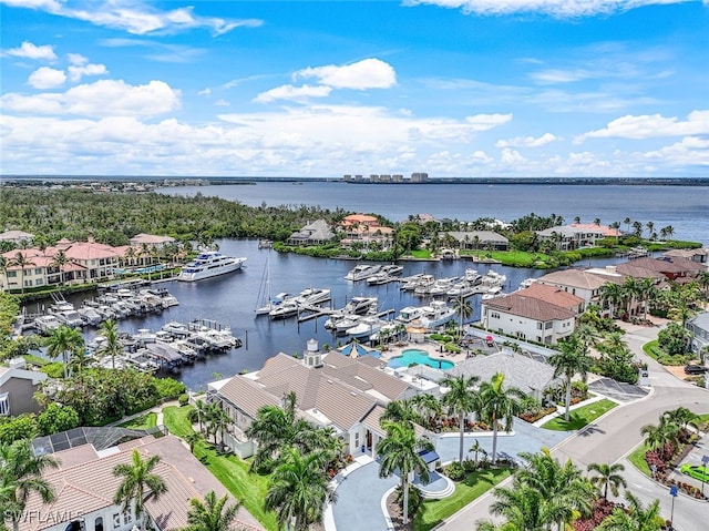 birds eye view of property with a water view