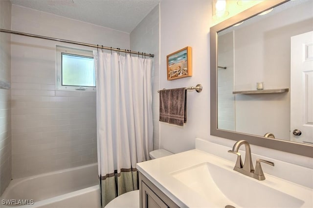 full bathroom featuring vanity, shower / tub combo, a textured ceiling, and toilet