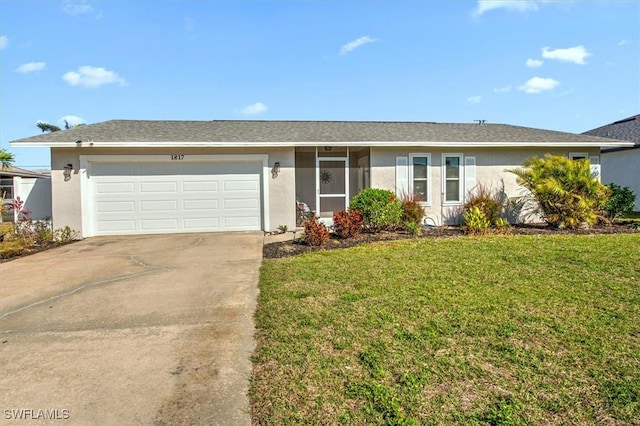 single story home featuring a garage and a front yard