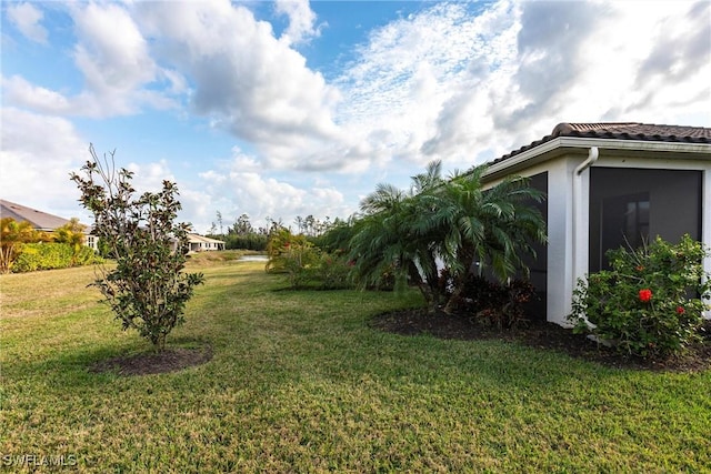 view of yard featuring a sunroom