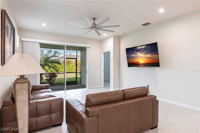 tiled living room with ceiling fan