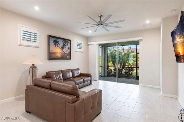 tiled living room with ceiling fan