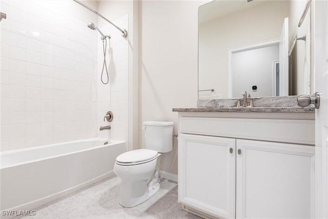 full bathroom featuring vanity, tile patterned floors, toilet, and tiled shower / bath