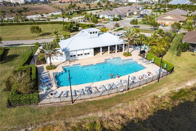 view of swimming pool featuring a water view