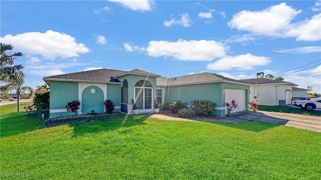 view of front facade with a garage and a front lawn