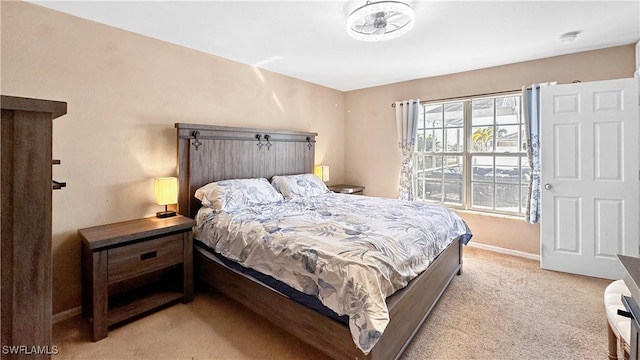 bedroom featuring light carpet