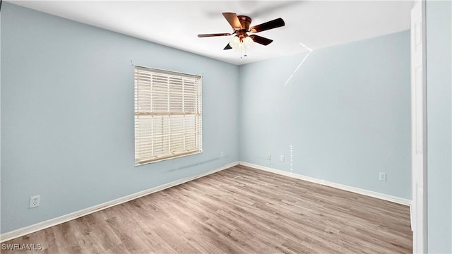 empty room featuring ceiling fan and light wood-type flooring