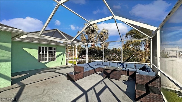 view of patio with an outdoor living space and a lanai