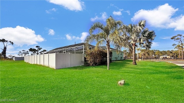 view of yard with a lanai