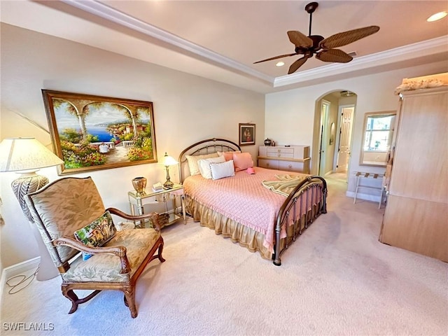 28880 Kiranicola Ct, Bonita Springs, FL 34135 - bedroom with arched walkways, ornamental molding, light carpet, a tray ceiling, and recessed lighting