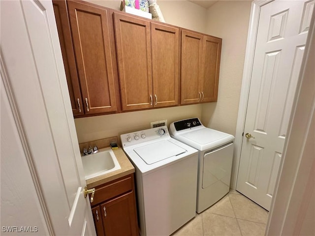 28880 Kiranicola Ct, Bonita Springs, FL 34135 - laundry area with cabinet space, washer and dryer, and light tile patterned floors