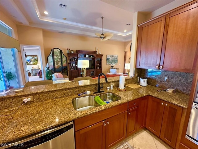 28880 Kiranicola Ct, Bonita Springs, FL 34135 - kitchen featuring a sink, stone countertops, dishwasher, ceiling fan, and a raised ceiling