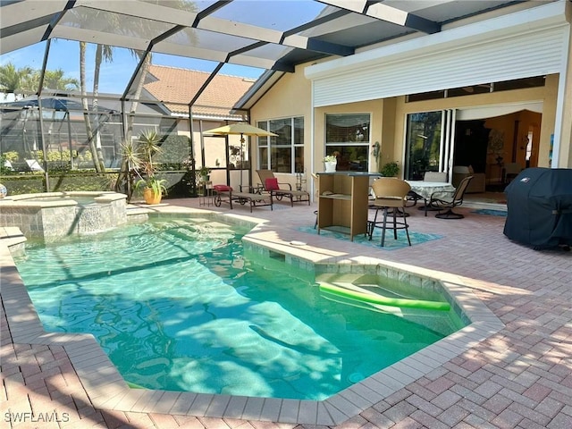 view of swimming pool with a pool with connected hot tub, glass enclosure, a patio, and grilling area