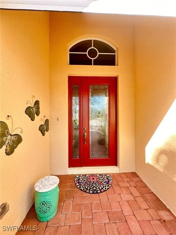 28880 Kiranicola Ct, Bonita Springs, FL 34135 - property entrance featuring stucco siding