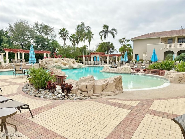 community pool featuring a patio area and a pergola