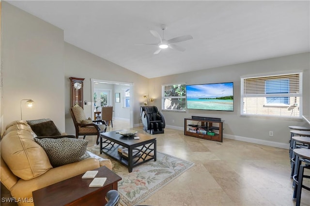 living room featuring ceiling fan and lofted ceiling