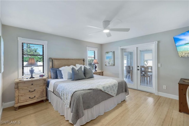 bedroom with french doors, ceiling fan, multiple windows, and access to outside