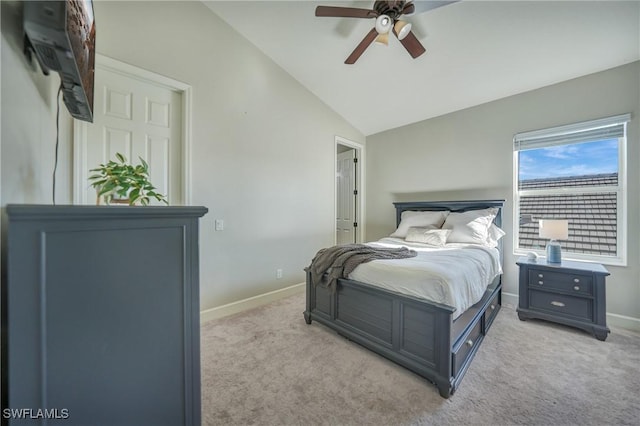 carpeted bedroom featuring lofted ceiling and ceiling fan